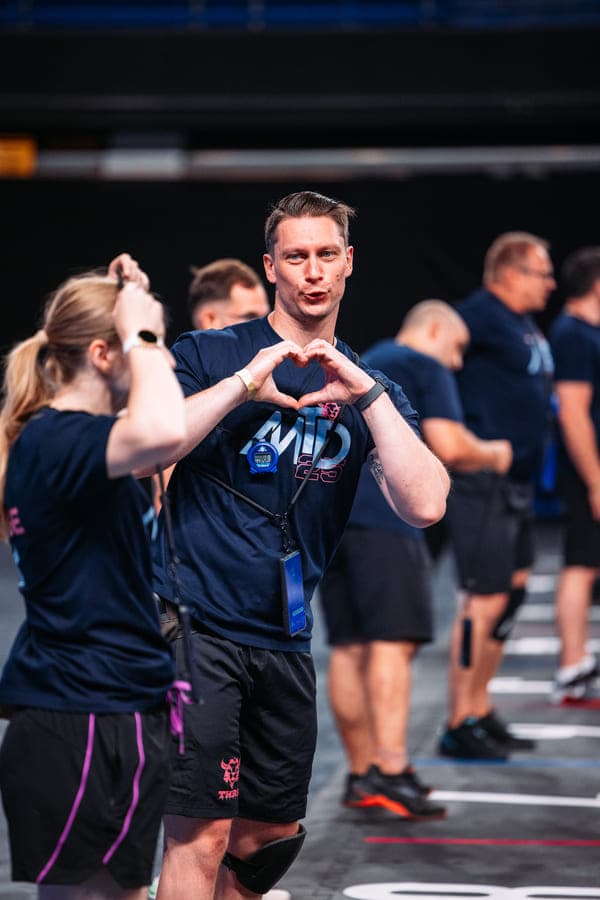 Volunteer helping athlete